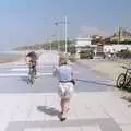 John Willy cycles with his club shirt over his head, A BSCC Bike Ride to Gravelines, Pas de Calais, France - 11th May 2000