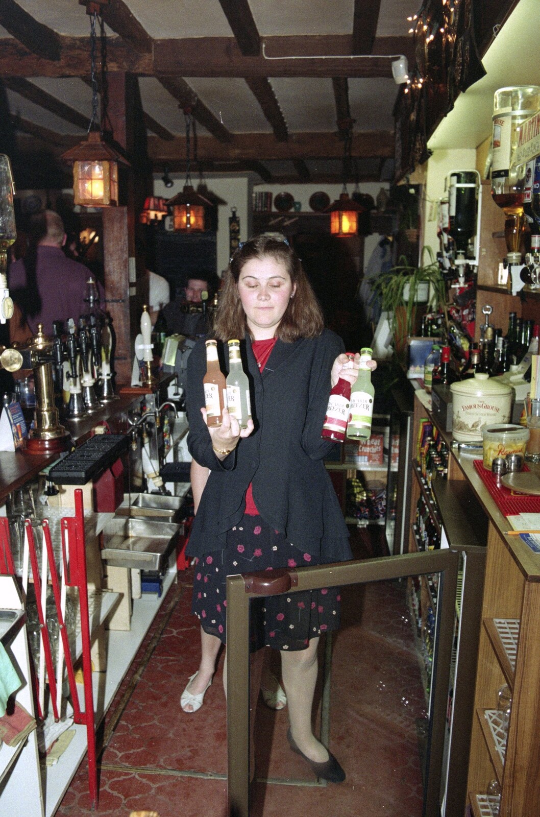 Claire armed with bottles from Wavy's Thirtieth Birthday, The Swan Inn, Brome, Suffolk - 24th May 2000