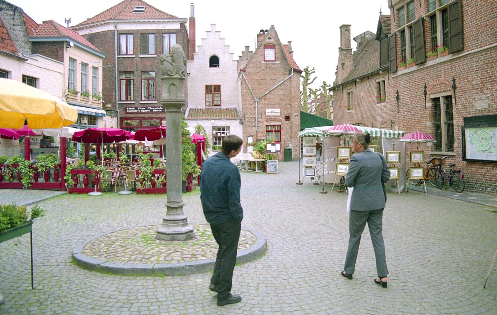 Andrew and Margaret roam about in a town square from CISU: An SCC Day-Trip to Bruges, Belgium - 26th May 2000