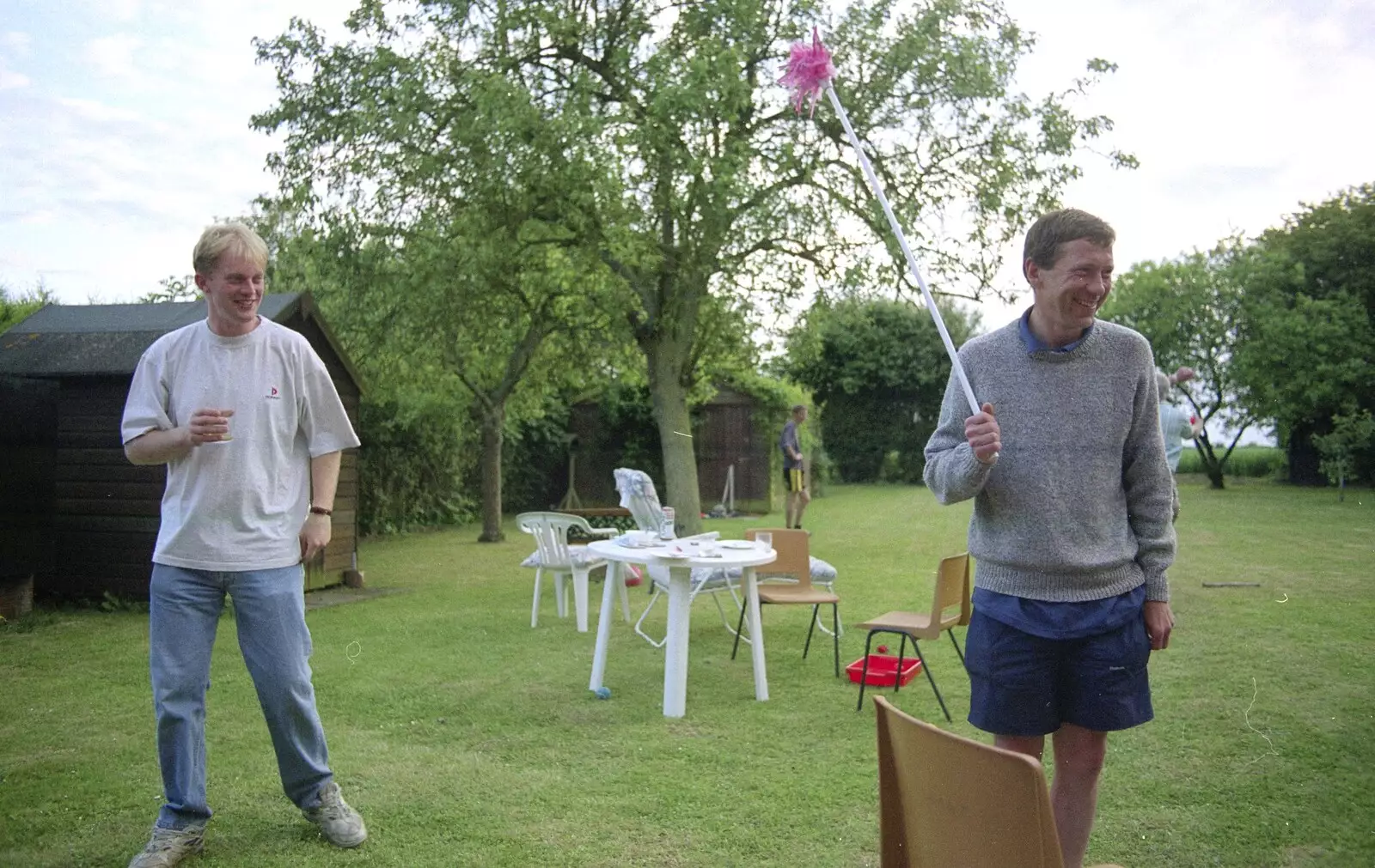 Paul and Apple (who's got a thing on a stick), from Colin and Jill's Barbeque, Suffolk - 28th May 2000