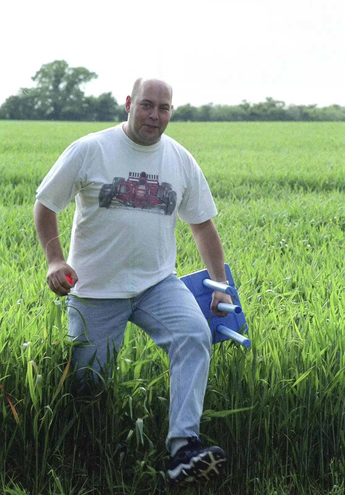 Dougie fetches the ball from the long wheat, from Colin and Jill's Barbeque, Suffolk - 28th May 2000