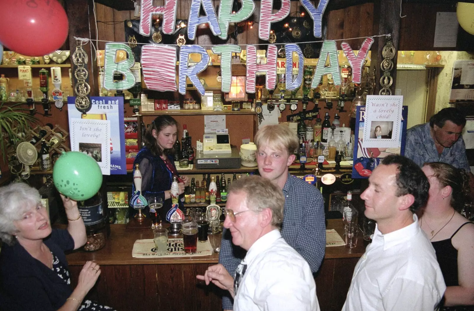 Spammy, John, Paul, DH and a birthday sign, from Lorraine's 21st Birthday, The Swan, Suffolk - 10th June 2000