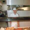 2000 Phil the canteen manager behind some troughs of food