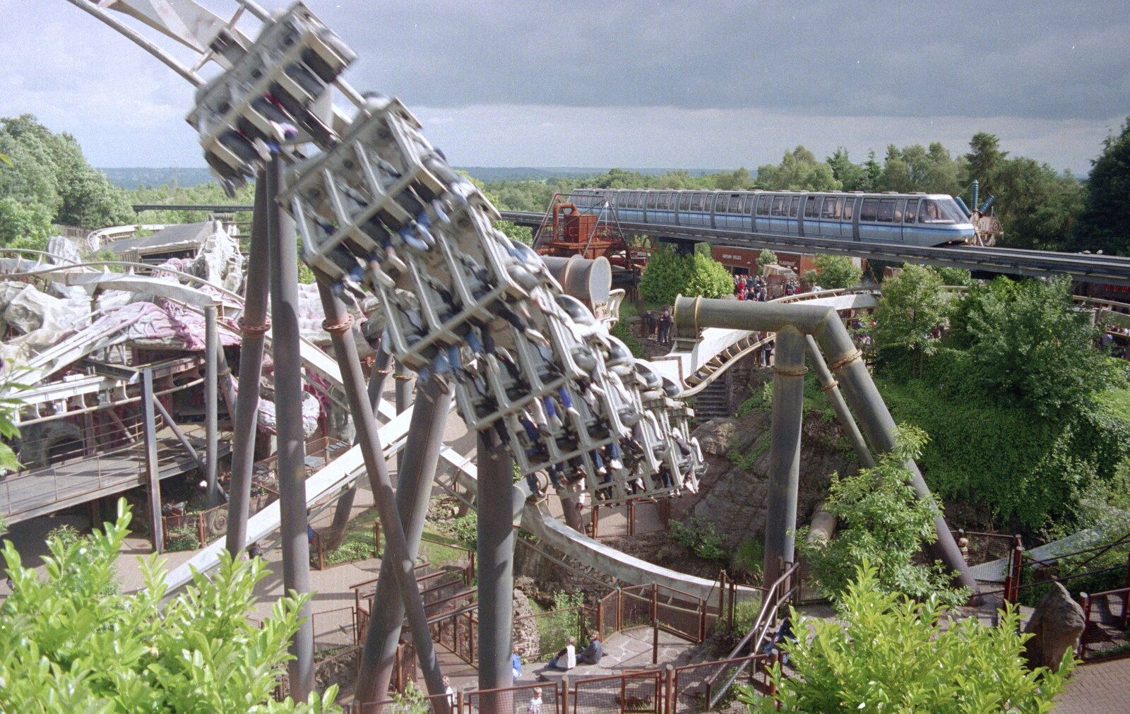 A Trip to Alton Towers, Staffordshire - 15th June 2000: A rollercoaster ride steams round as the monorail passes by sedately