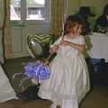 A bridesmaid roams around with balloons, Sean and Michelle's Wedding, Bashley FC, New Milton - 12th August 2000