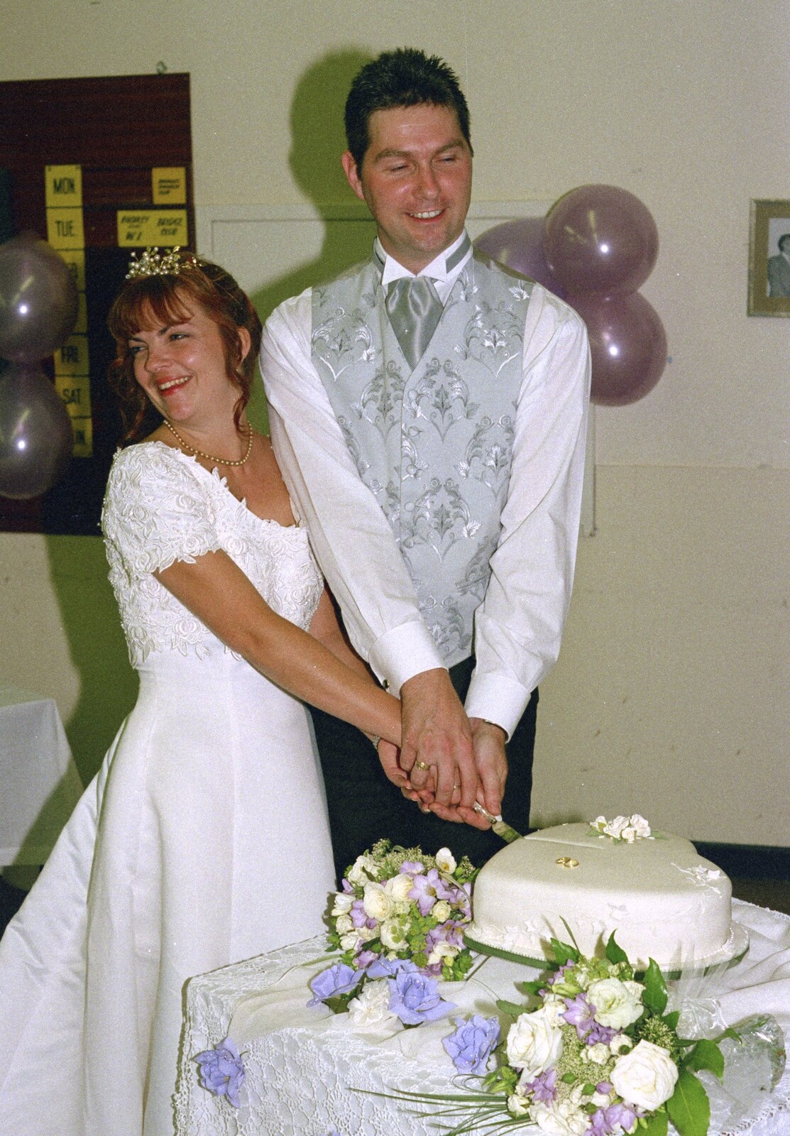 Sean chops cake with his eyes closed from Sean and Michelle's Wedding, Bashley FC, New Milton - 12th August 2000