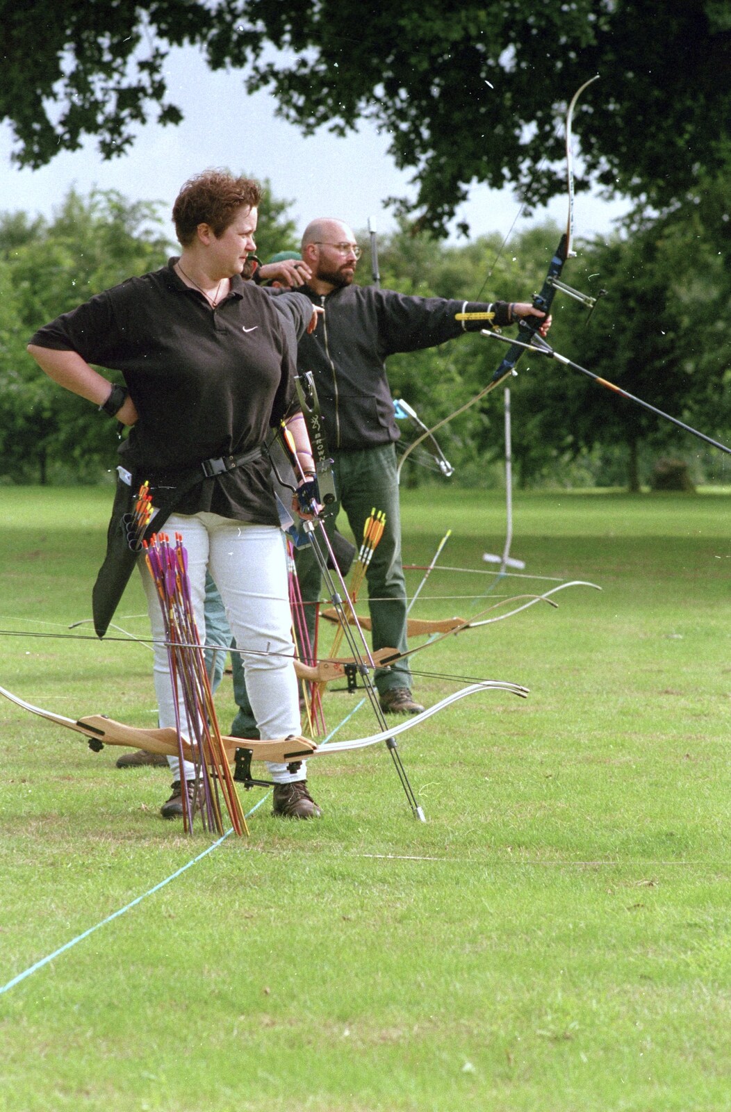 Pauline contemplates her next arrow from Kai's 2nd and a Bit of Archery, Hampshire and Suffolk - 13th August 2000