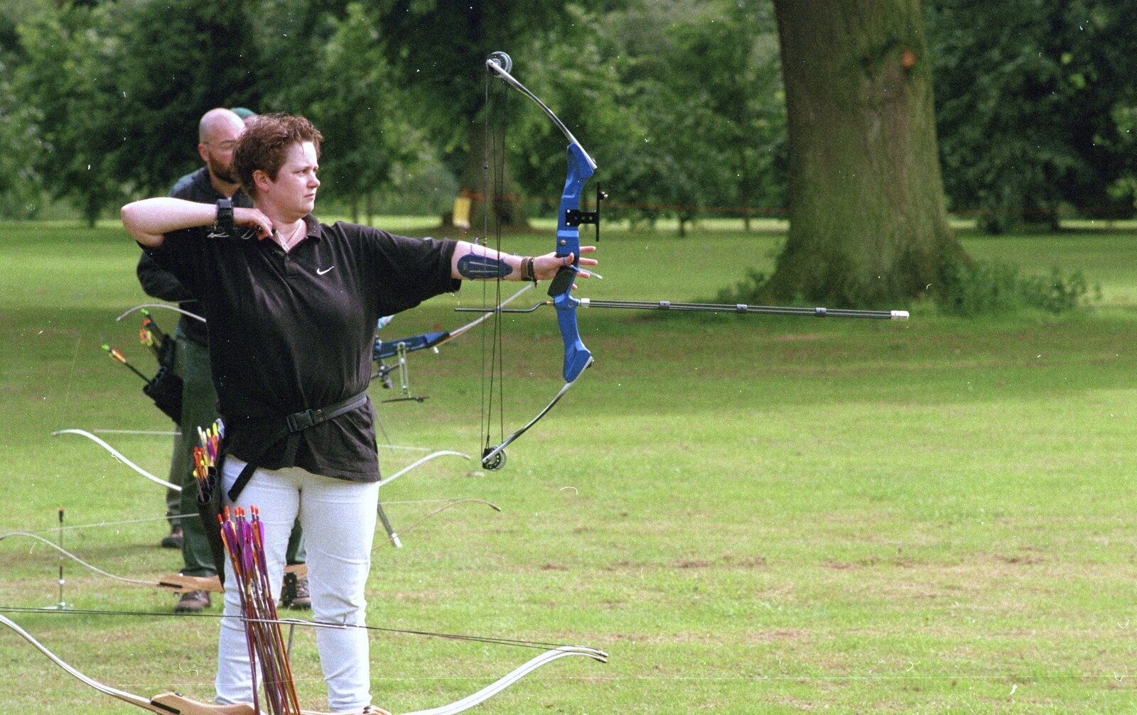Pauline fires one off from Kai's 2nd and a Bit of Archery, Hampshire and Suffolk - 13th August 2000