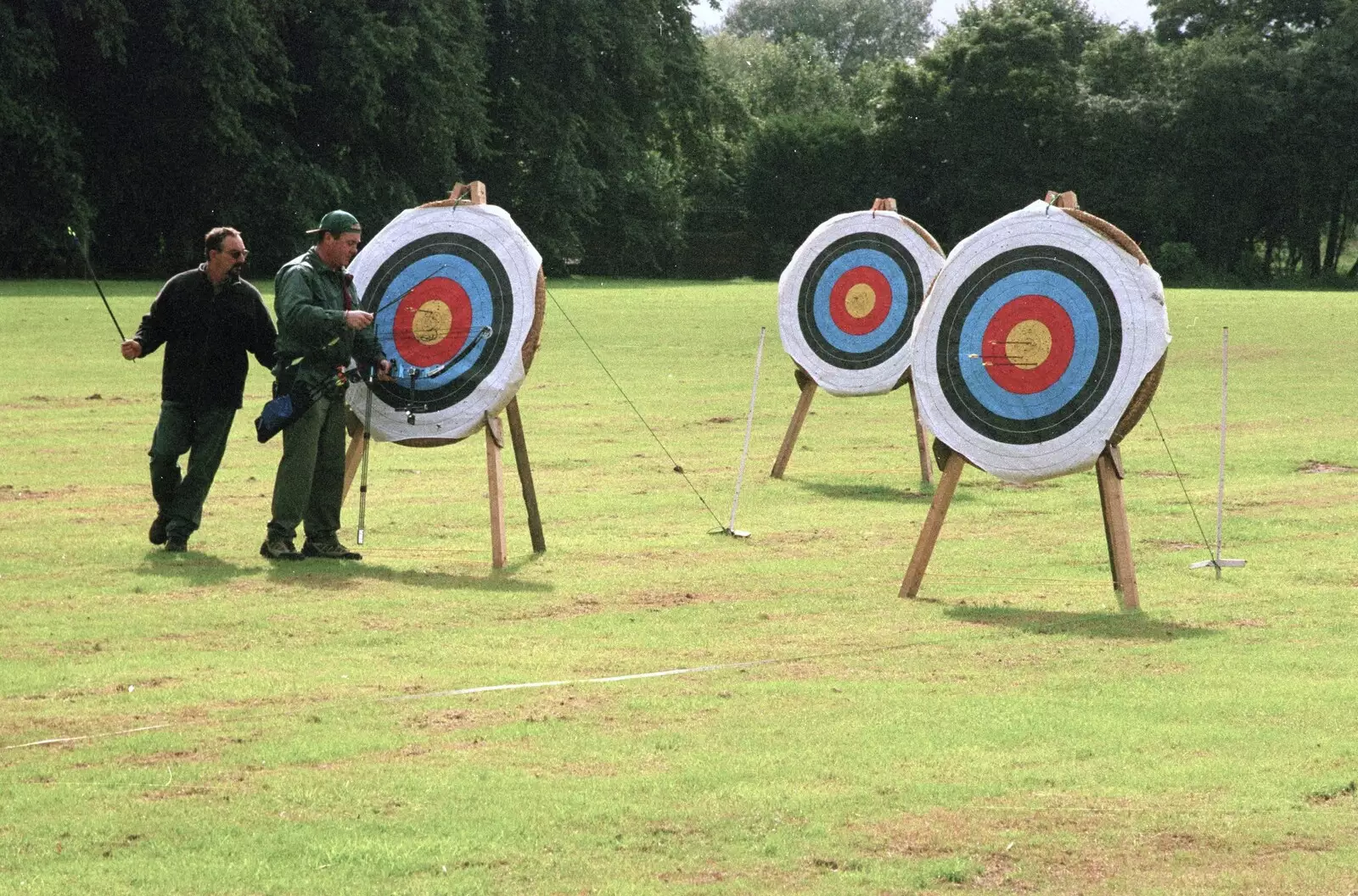 Checking the results of a post of archery, from Kai's 2nd and a Bit of Archery, Hampshire and Suffolk - 13th August 2000