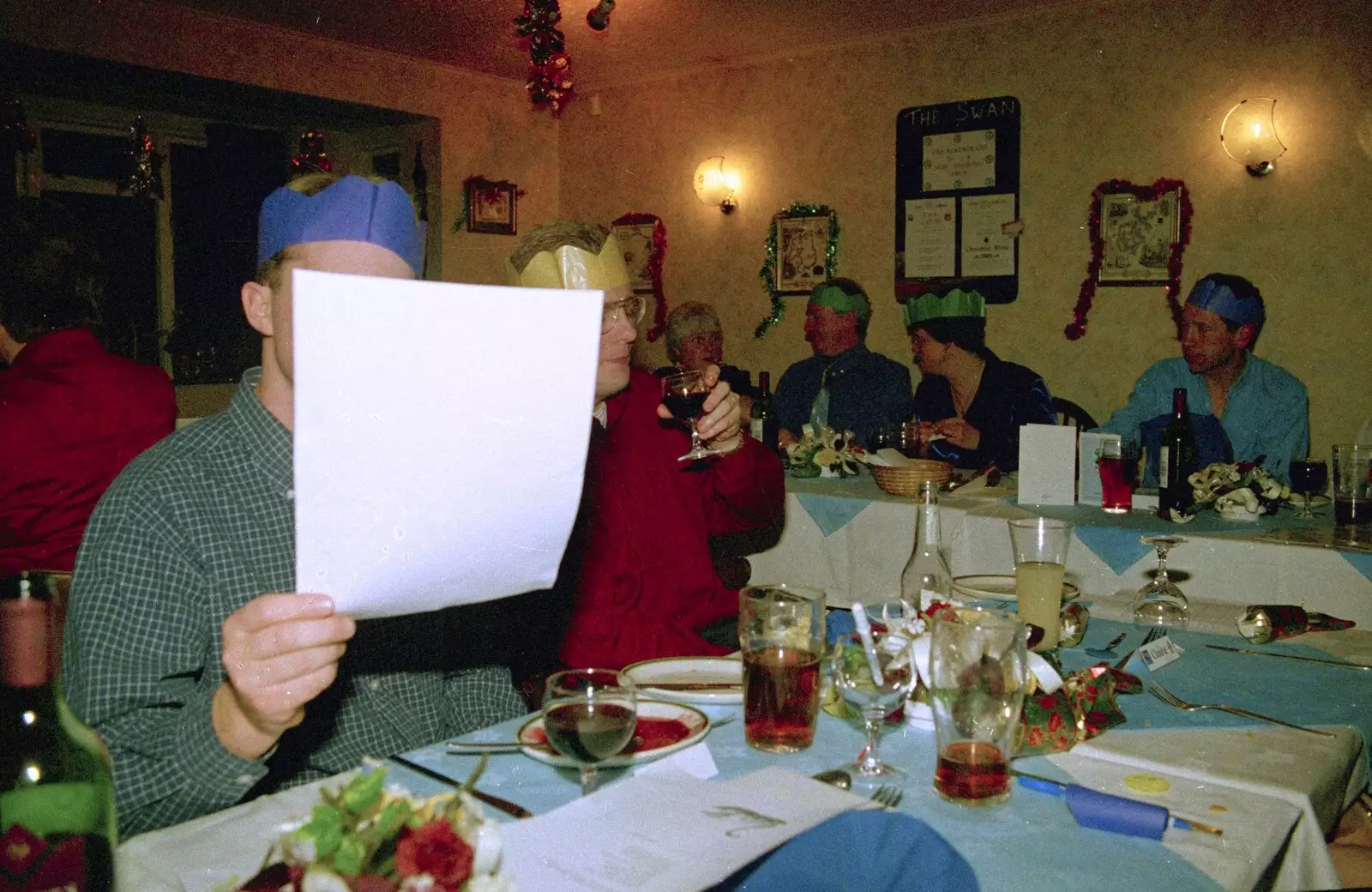 A hidden Paul looks at some paper, from The BSCC Christmas Dinner, The Swan Inn, Brome, Suffolk - 8th December 2000