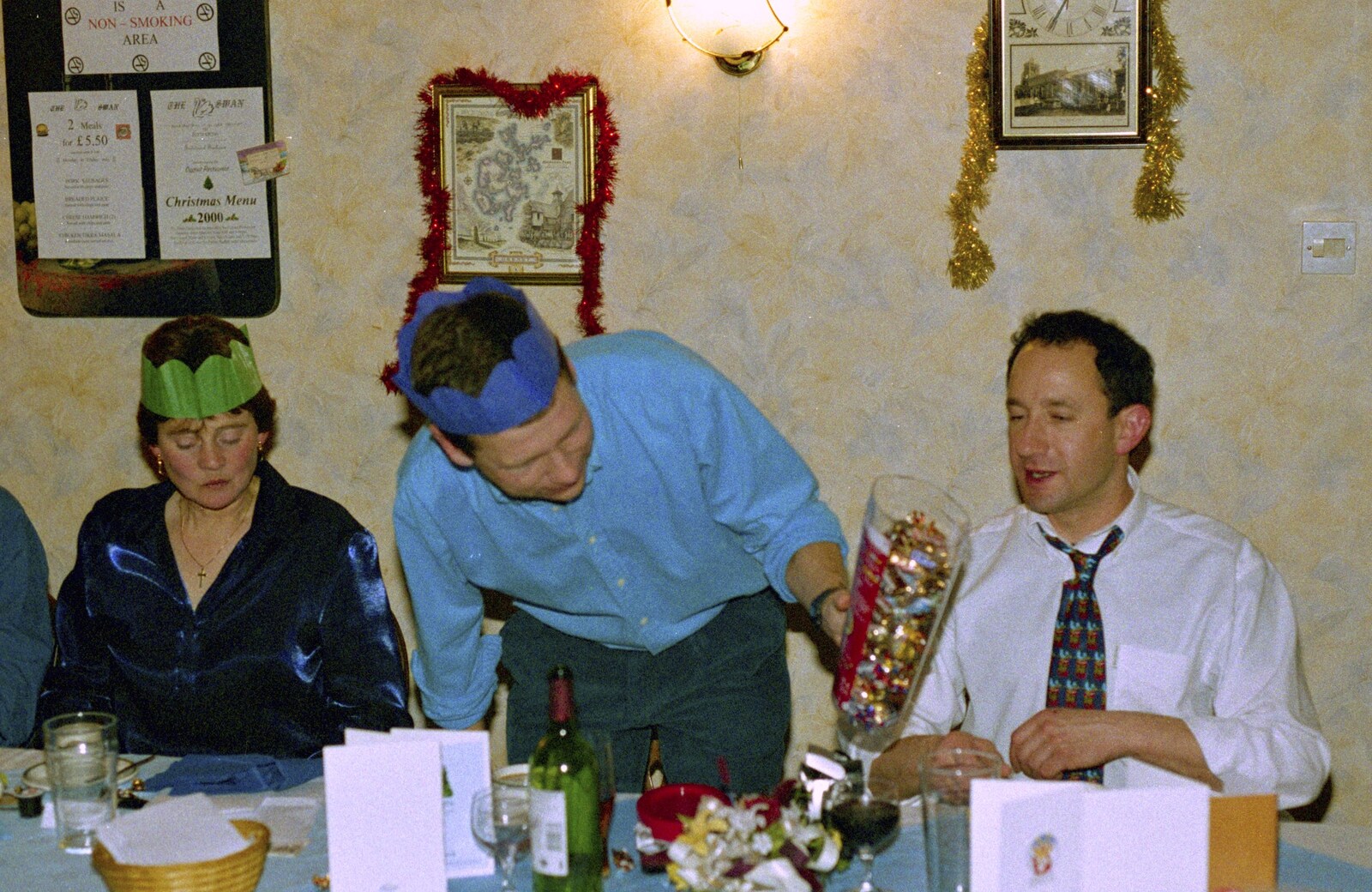 Apple offers some chocolates around from The BSCC Christmas Dinner, The Swan Inn, Brome, Suffolk - 8th December 2000