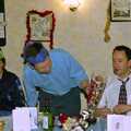 Apple offers some chocolates around, The BSCC Christmas Dinner, The Swan Inn, Brome, Suffolk - 8th December 2000