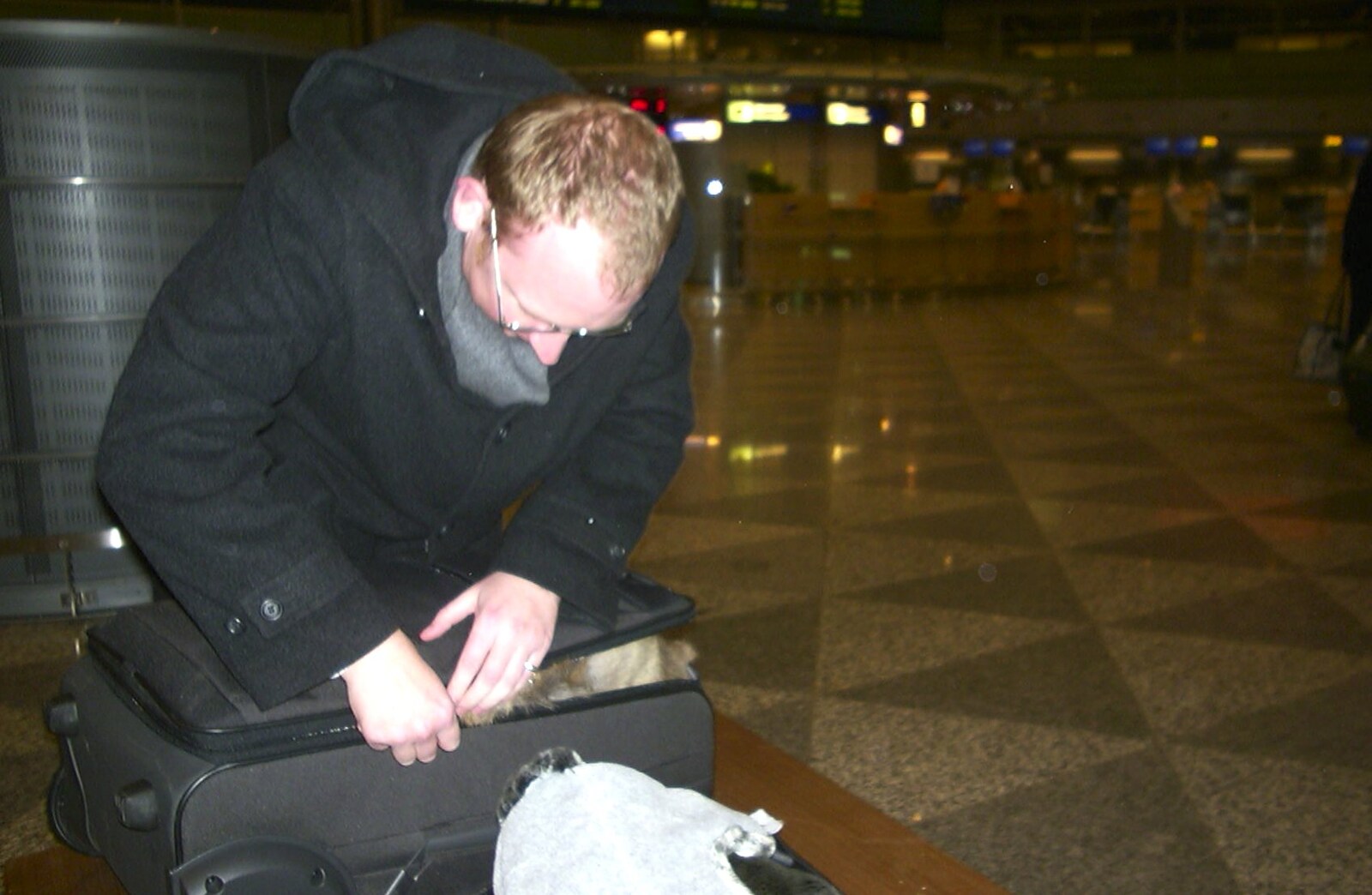Julian stuffs a reindeer skin in to his suitcase from A 3G Lab Press Tour of Helsinki and Stockholm, Finland and Sweden - 12th March 2001