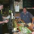 The bar dude checks a menu, The BSCC Annual Bike Ride, Marquess of Exeter, Oakham, Rutland - 12th May 2001