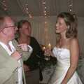Julian talks to the bride, Genaya's Wedding Reception, near Badwell Ash, Suffolk - 20th May 2001