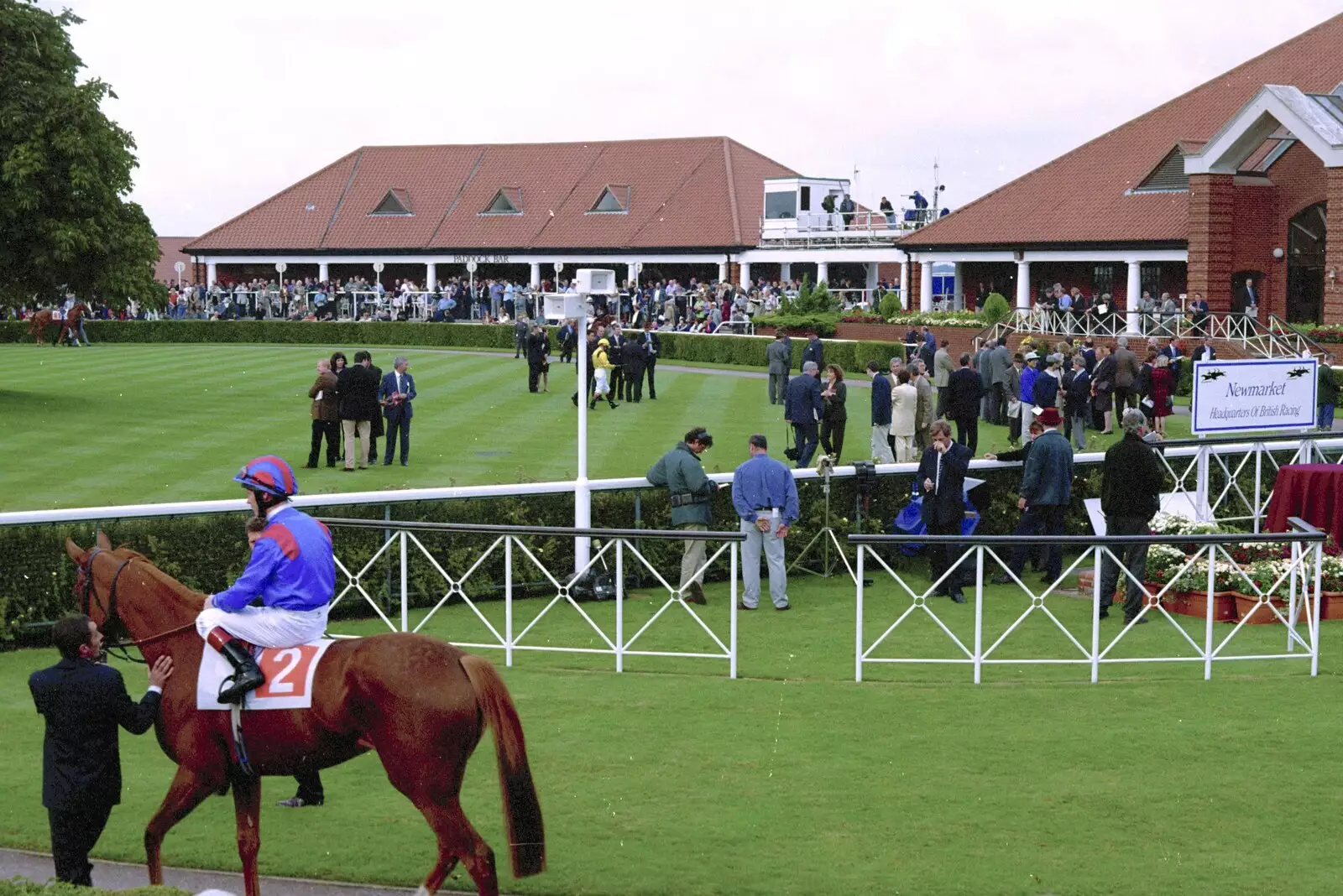 Another horse trots around the parade ring, from 3G Lab Goes to the Races, Newmarket, Suffolk - 15th July 2001