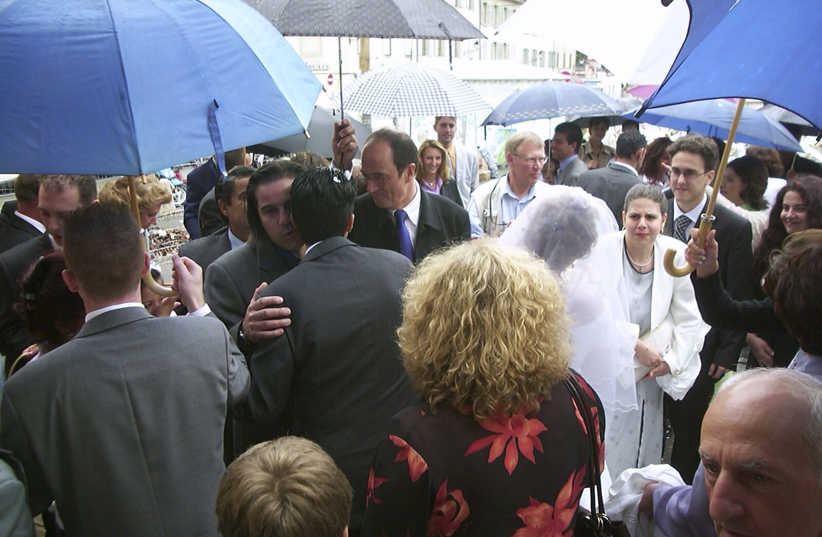 The bride and groom are mobbed outside from Elisa and Luigi's Wedding, Carouge, Geneva, Switzerland - 20th July 2001