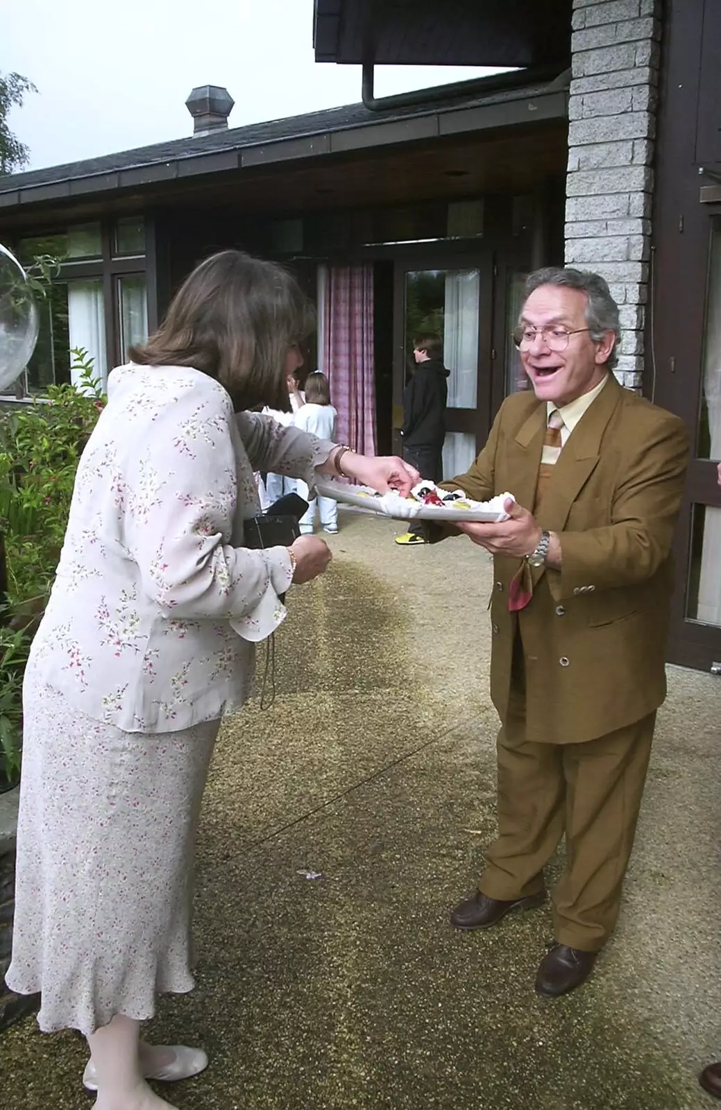 Caroline takes a canapé, from Elisa and Luigi's Wedding, Carouge, Geneva, Switzerland - 20th July 2001