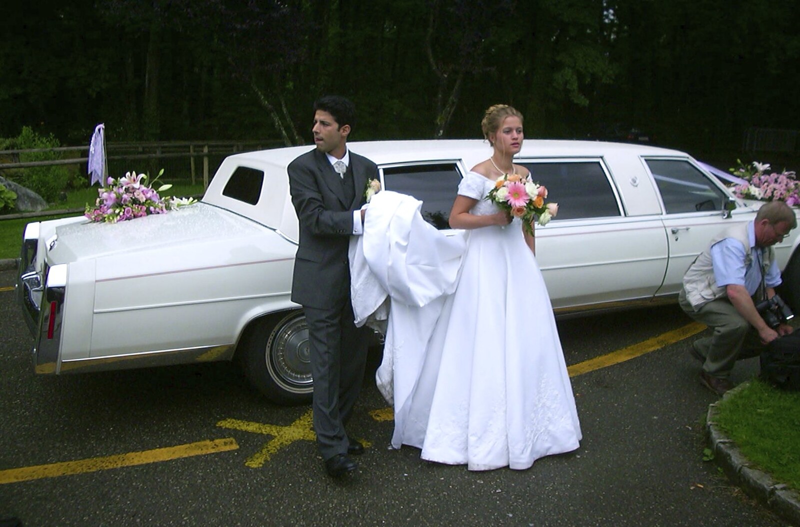 Theres a photoshoot by the bridal limo from Elisa and Luigi's Wedding, Carouge, Geneva, Switzerland - 20th July 2001