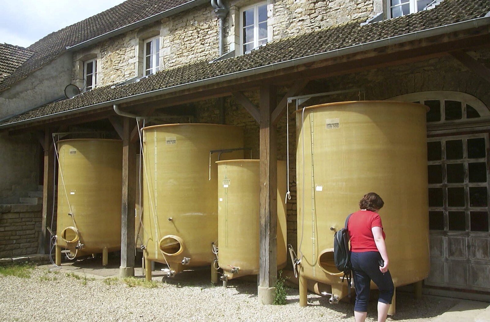 Sis roams around by old fermentation tanks from A Short Holiday in Chivres, Burgundy, France - 21st July 2001