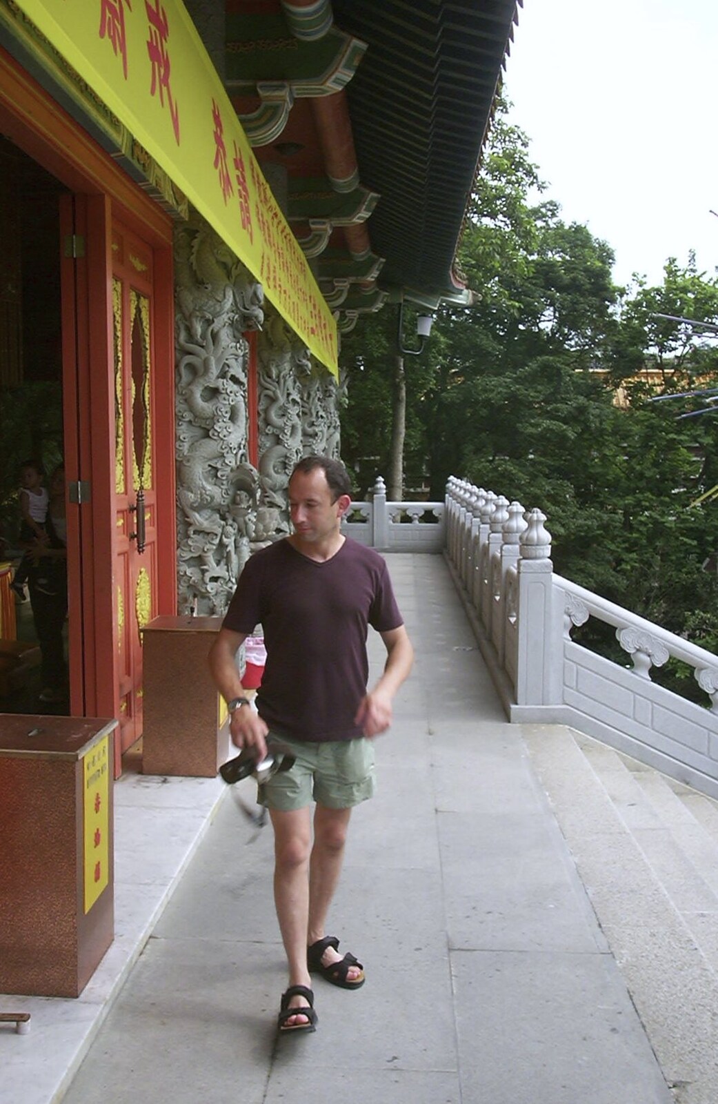 Lantau Island and the Po Lin Monastery, Hong Kong, China - 14th August 2001: DH mills around outside