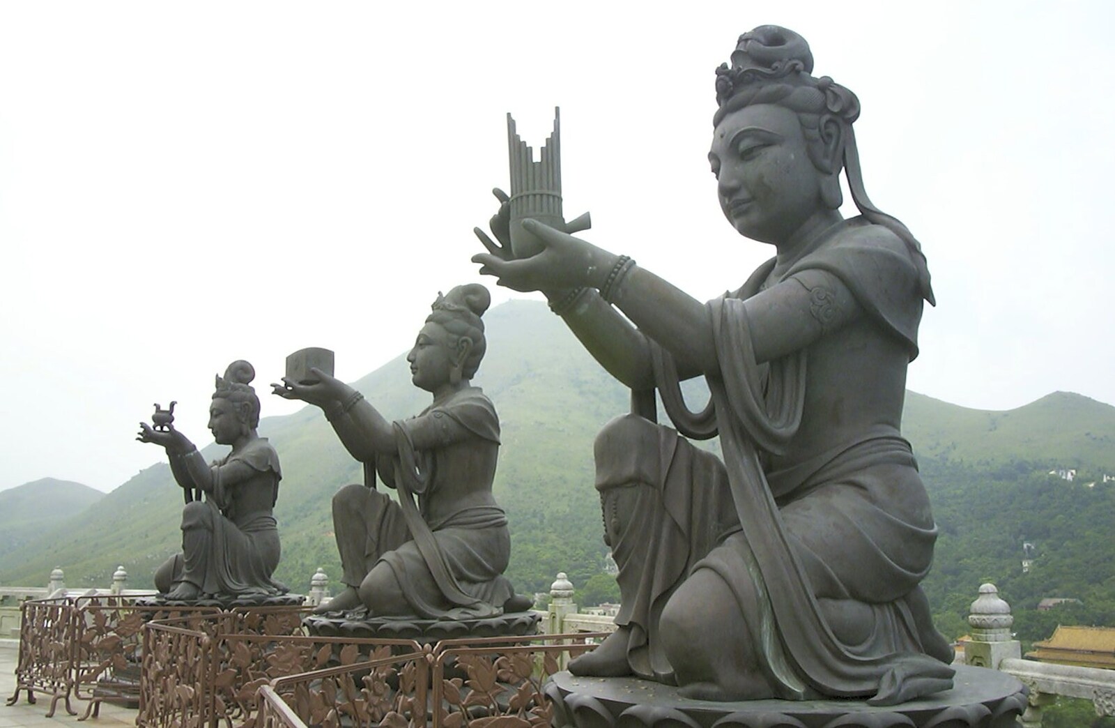 Lantau Island and the Po Lin Monastery, Hong Kong, China - 14th August 2001: The statues make offerings to Buddha