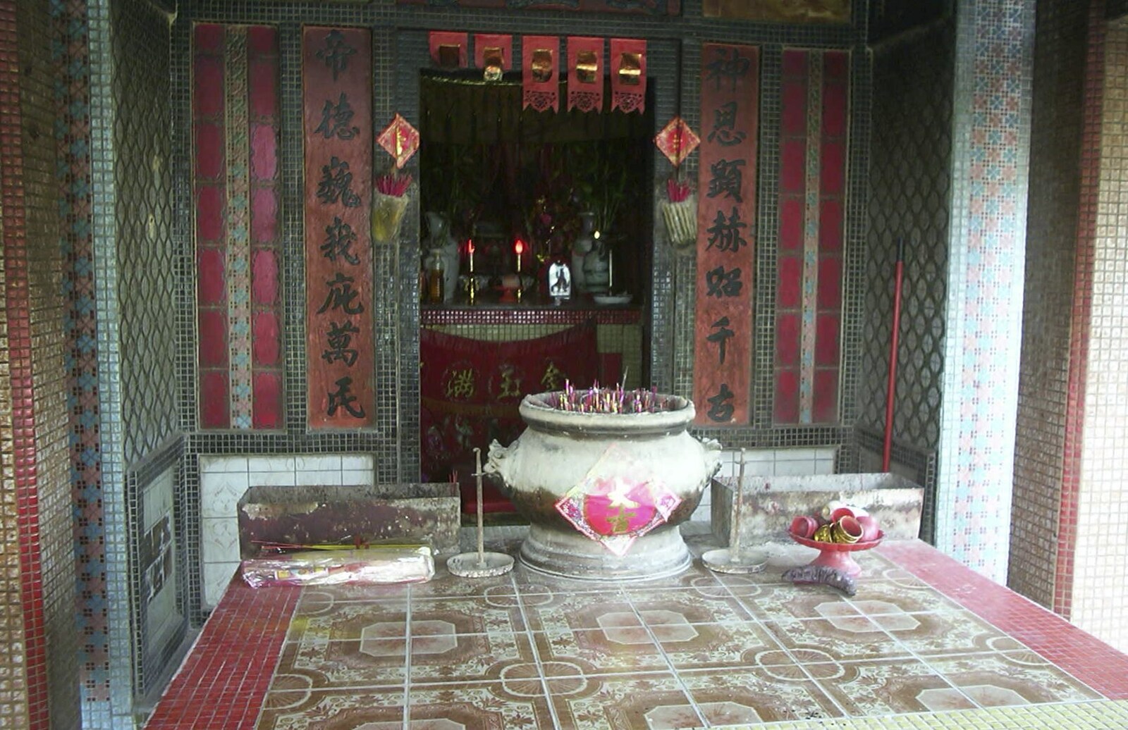 Lamma Island, Hong Kong, China - 20th August 2001: Incense pots and a shrine