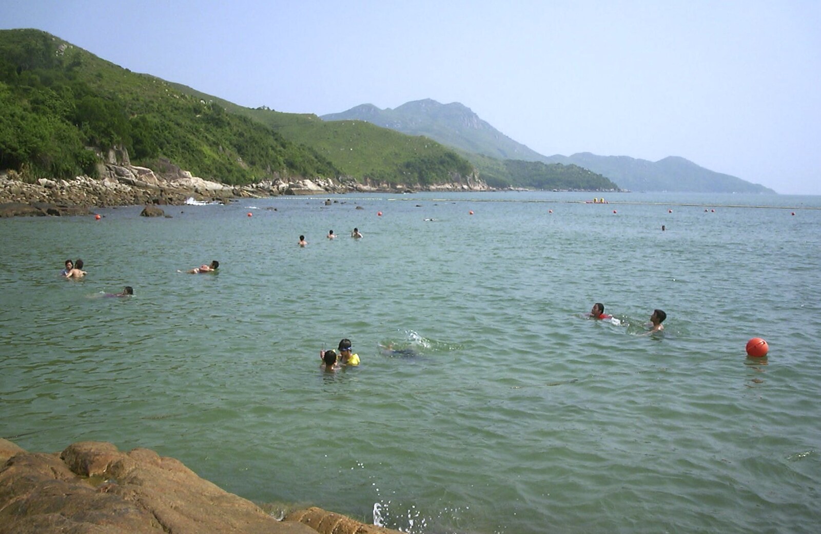 Lamma Island, Hong Kong, China - 20th August 2001: Lots of swimmers bob about
