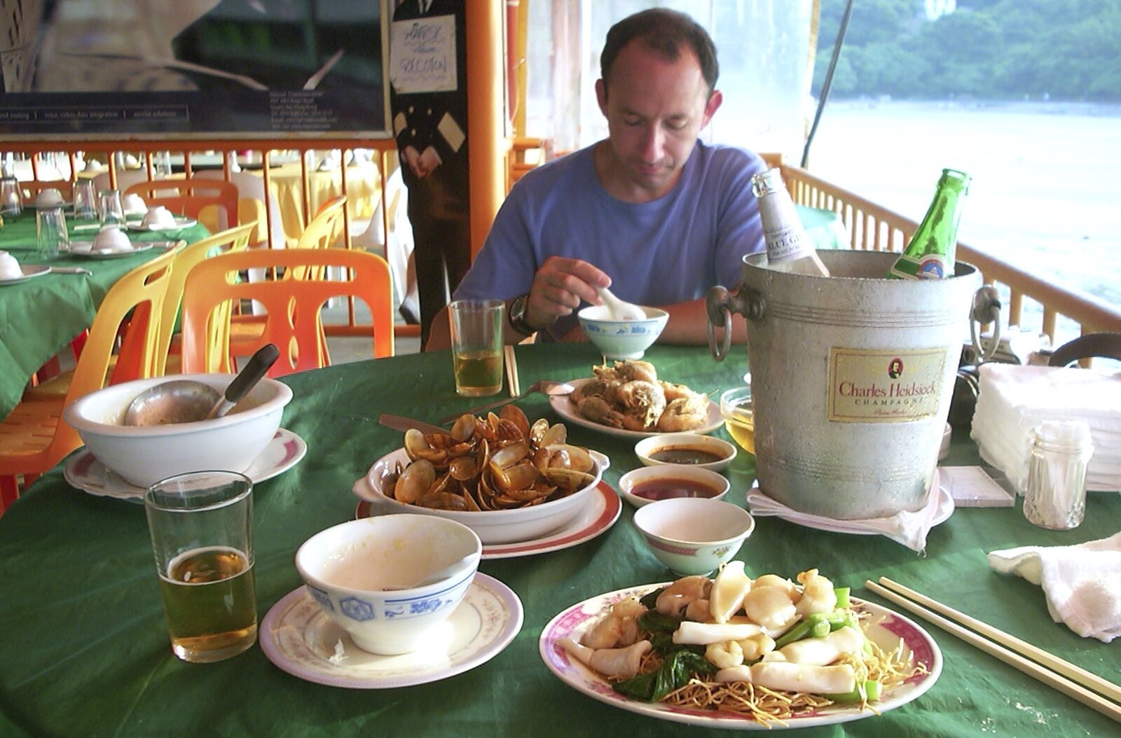 Lamma Island, Hong Kong, China - 20th August 2001: Nosher and DH dig into to a seafood-fest