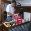 Nick stocks up the boat's frige with beer, A 3G Lab Sailing Trip, Shotley, Suffolk - 6th September 2001