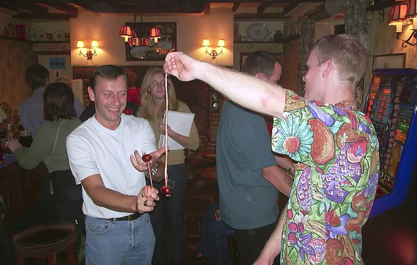 Ian lines up against Mikey P's conker, from Conkers at The Swan Inn and 3G Lab Pizza, Cambridge - 10th October 2001