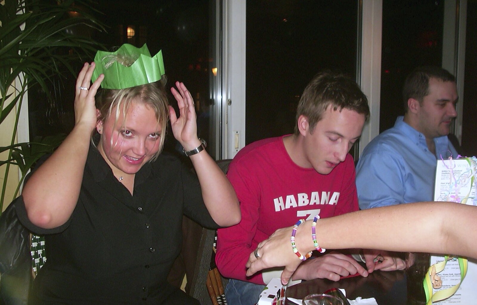 Michelle sticks a paper hat on from 3G Lab at Henry's, Quayside, Cambridge - 5th December 2001