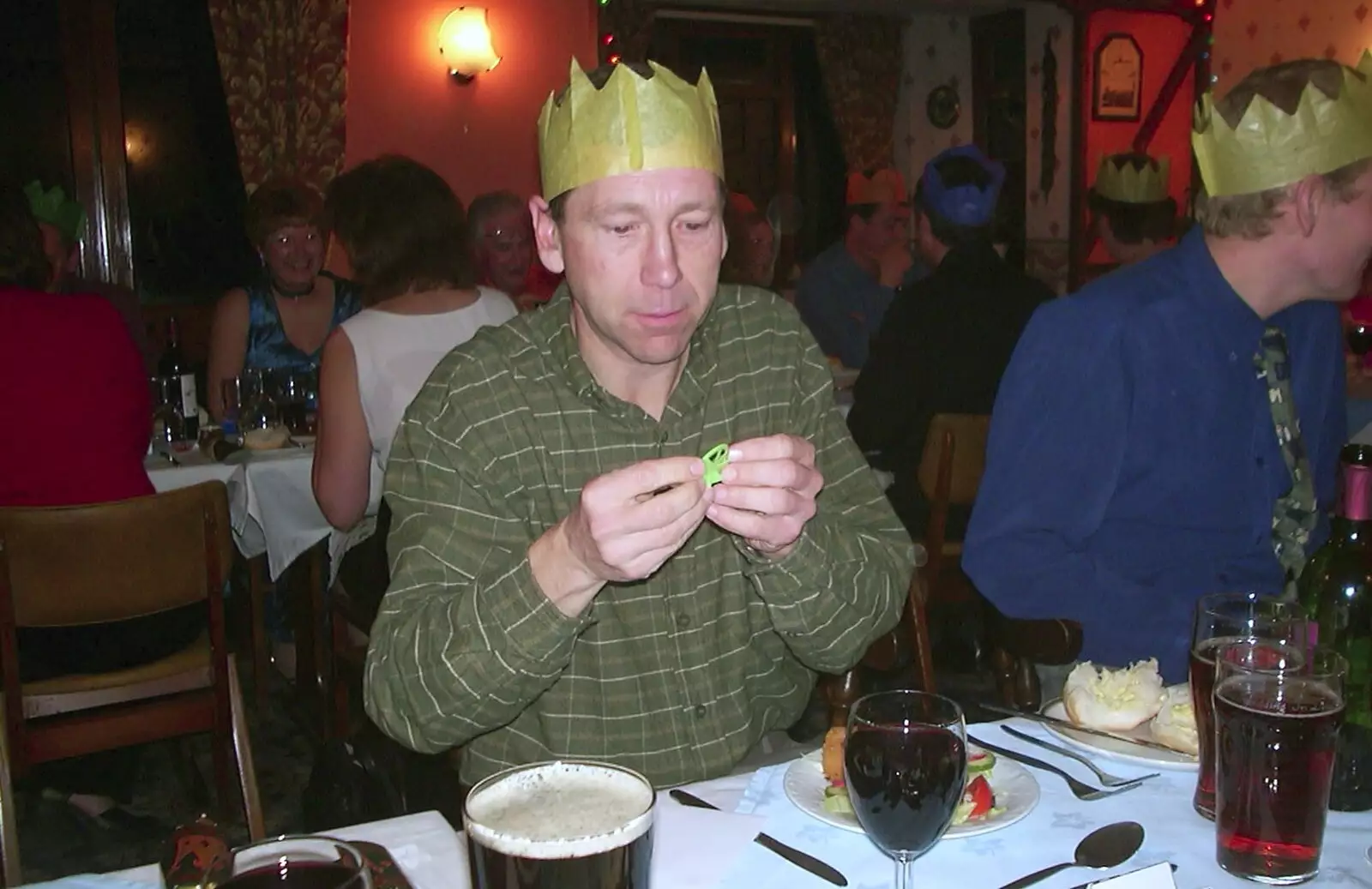 Apple inspects a cracker prize, from The BSCC Christmas Dinner, Brome Swan, Suffolk - 7th December 2001