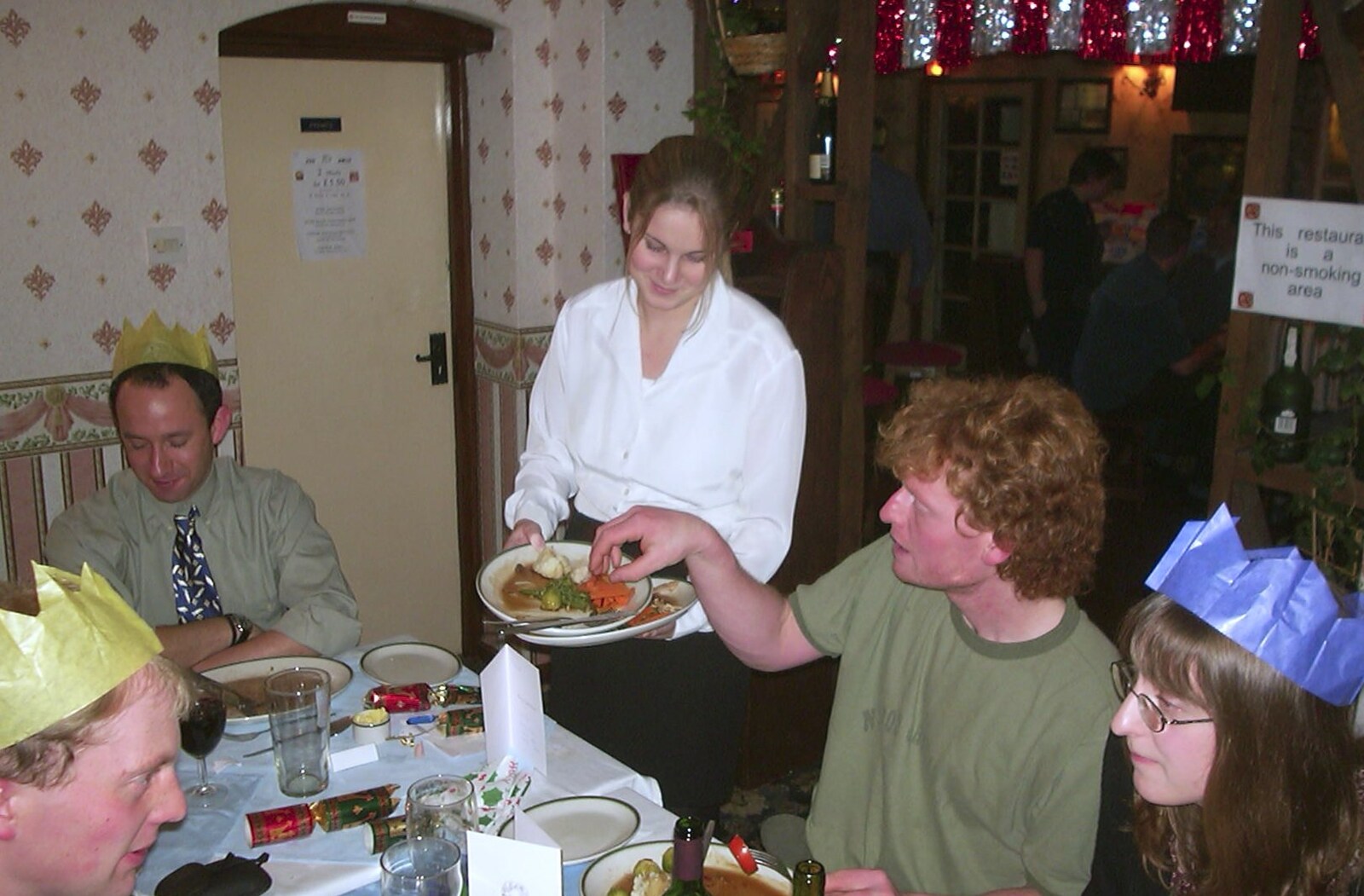 Wavy scavenges as Lorraine clears some plates away from The BSCC Christmas Dinner, Brome Swan, Suffolk - 7th December 2001