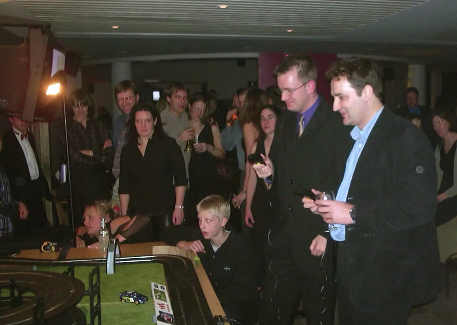 Nosher and Dan play Scalextric, from 3G Lab Christmas Party, Q-Ton Centre, Cambridge - 20th December 2001