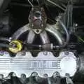 The Astra's engine and its missing carburettor, Nearly Christmas With Sis and Matt, Brome, Suffolk - 24th December 2001