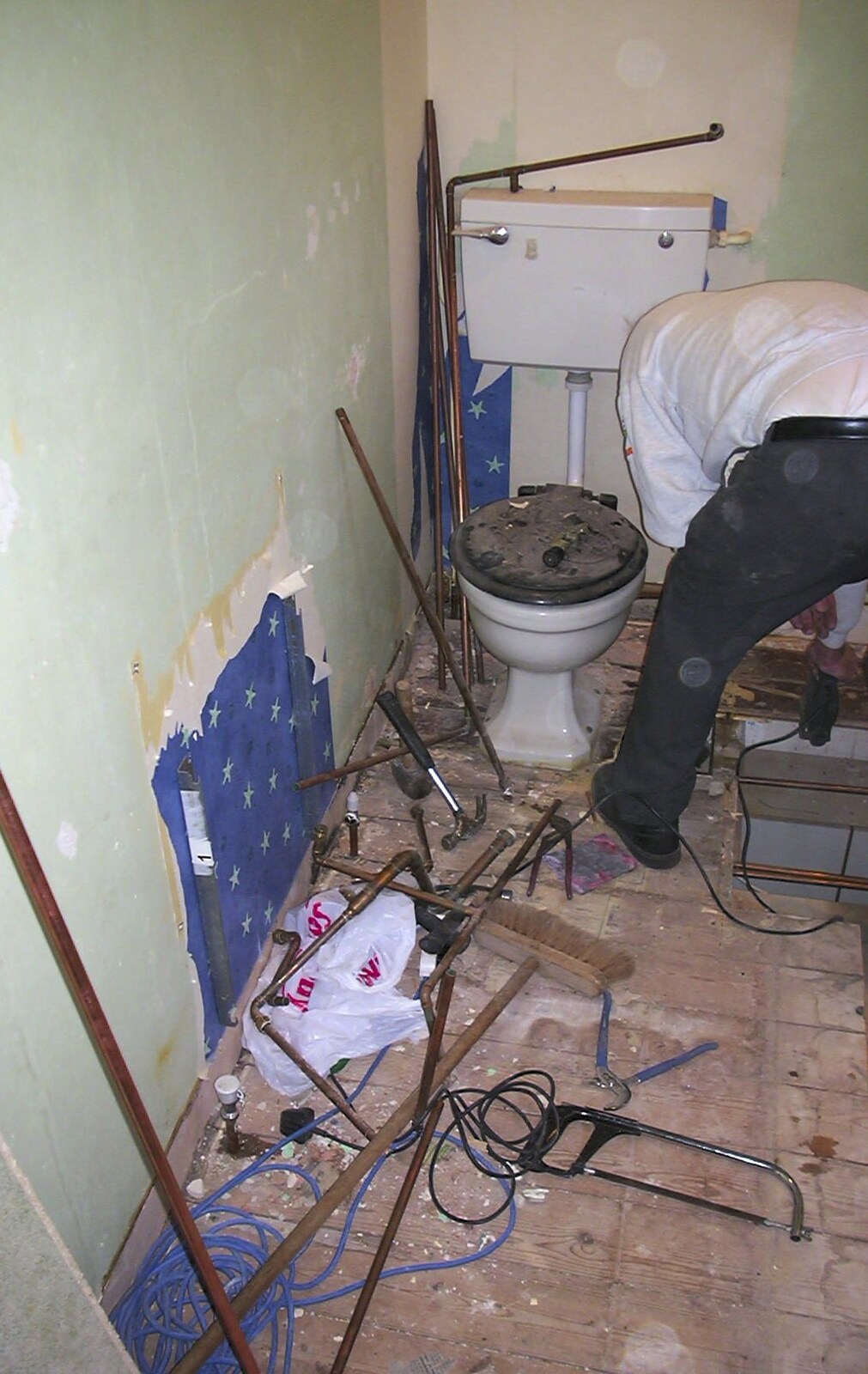 The Old Man pokes around near the toilet from Bathroom Rebuilding, Brome, Suffolk - 1st February 2002