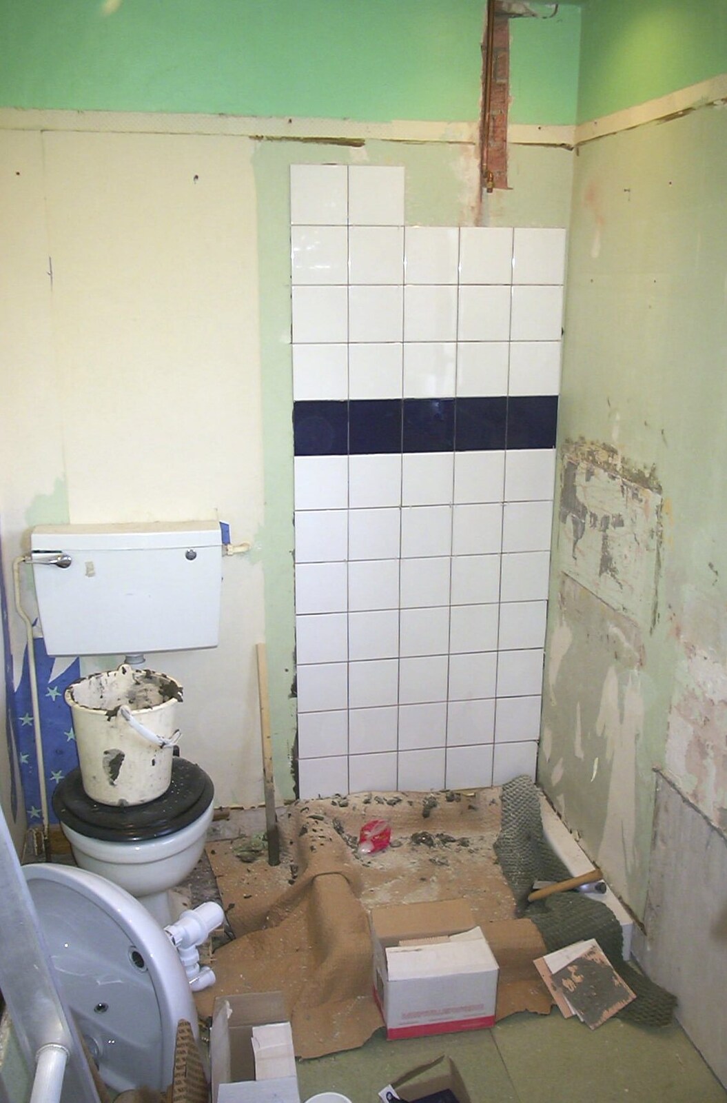 Tiles for a new shower cublicle go on the wall from Bathroom Rebuilding, Brome, Suffolk - 1st February 2002