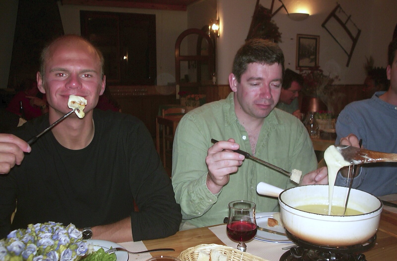 Rob Kurowski holds up bread and molten cheese from 3G Lab Goes Skiing In Chamonix, France - 12th March 2002