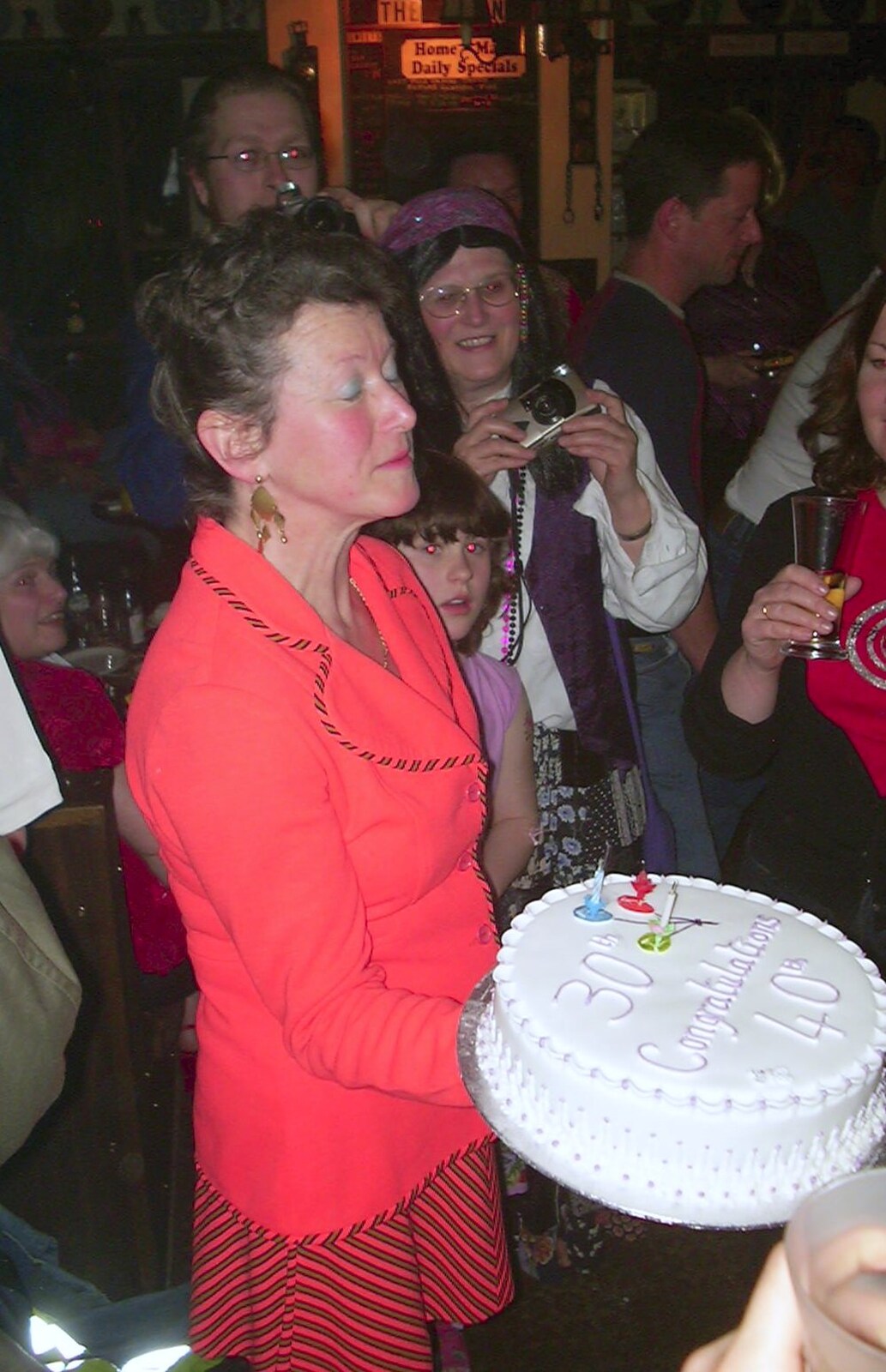 Sue and DH's 30th and 40th Party, The Swan, Suffolk - 18th March 2002: Sylvia bring a cake out
