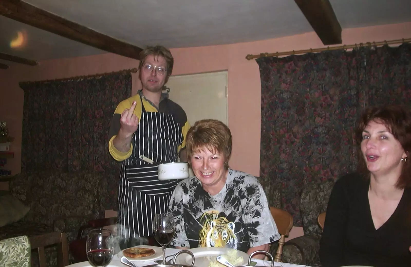 Marc flips the bird, from Anne's Birthday Curry and Cake, The Swan Inn, Brome - 24th March 2002