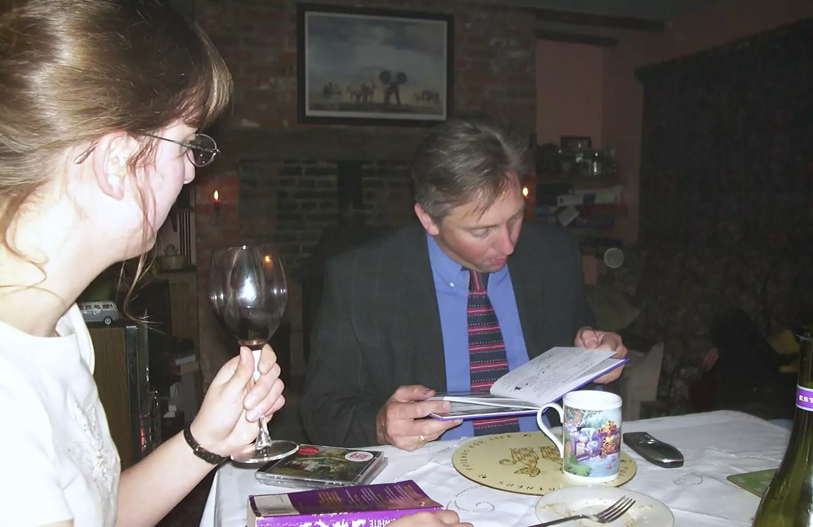 Nigel reads a book, from Anne's Birthday Curry and Cake, The Swan Inn, Brome - 24th March 2002