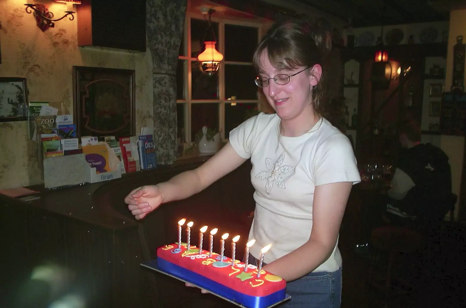 Suey brings out another cake in The Swan, from Anne's Birthday Curry and Cake, The Swan Inn, Brome - 24th March 2002