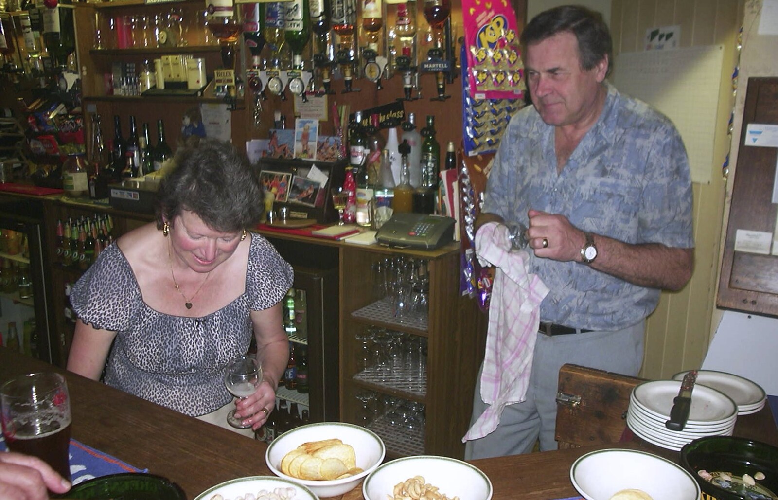 Sylvia and Alan behind the bar from Anne's Birthday Curry and Cake, The Swan Inn, Brome - 24th March 2002
