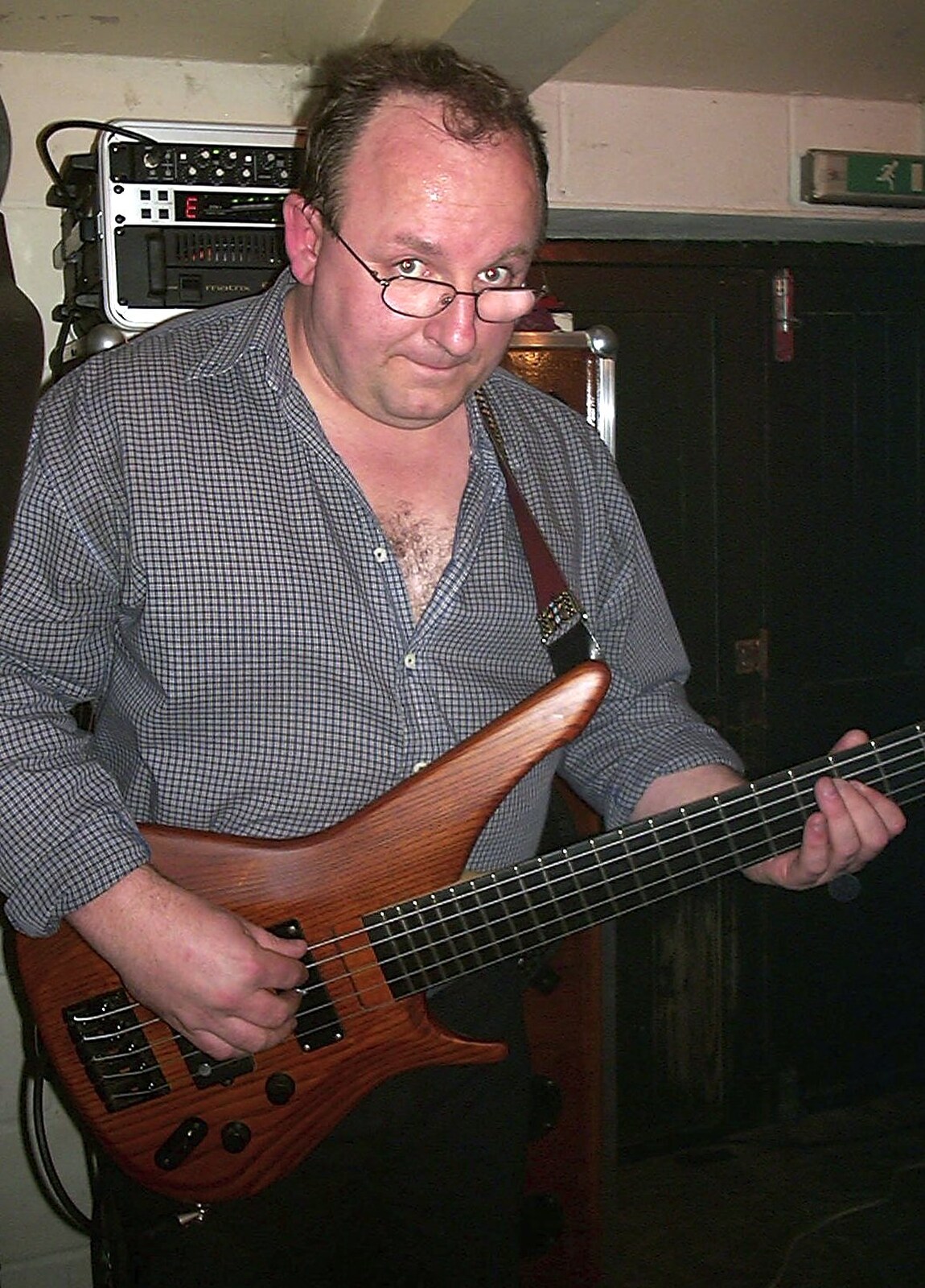 Mark on bass looks up from The BBs at the Cider Shed, Banham, Norfolk - 24th May 2002