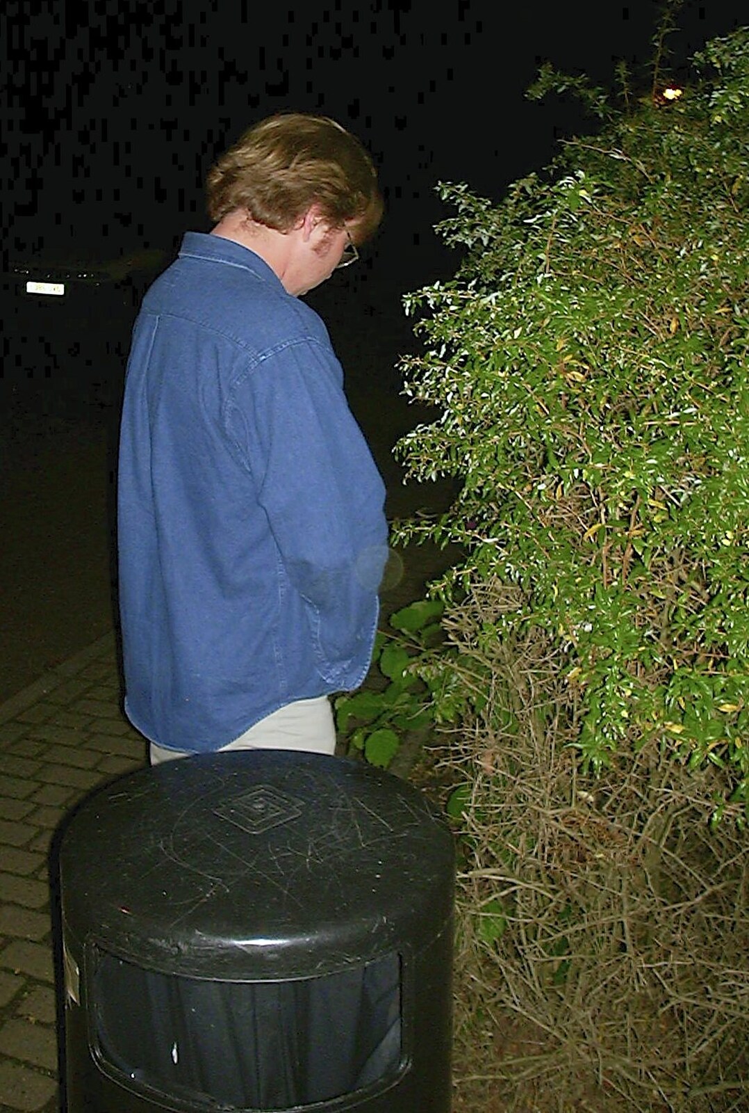 Marc has a wee in a hedge from The BBs at the Cider Shed, Banham, Norfolk - 24th May 2002
