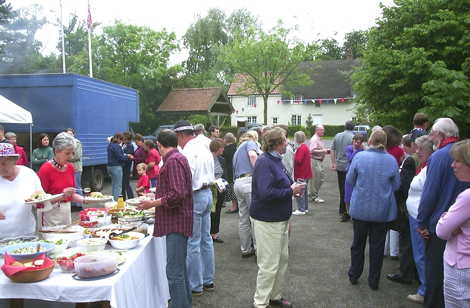 Crowds mill around from Golden Jubilee Celebrations, The Village Hall, Brome, Suffolk - 4th June 2002