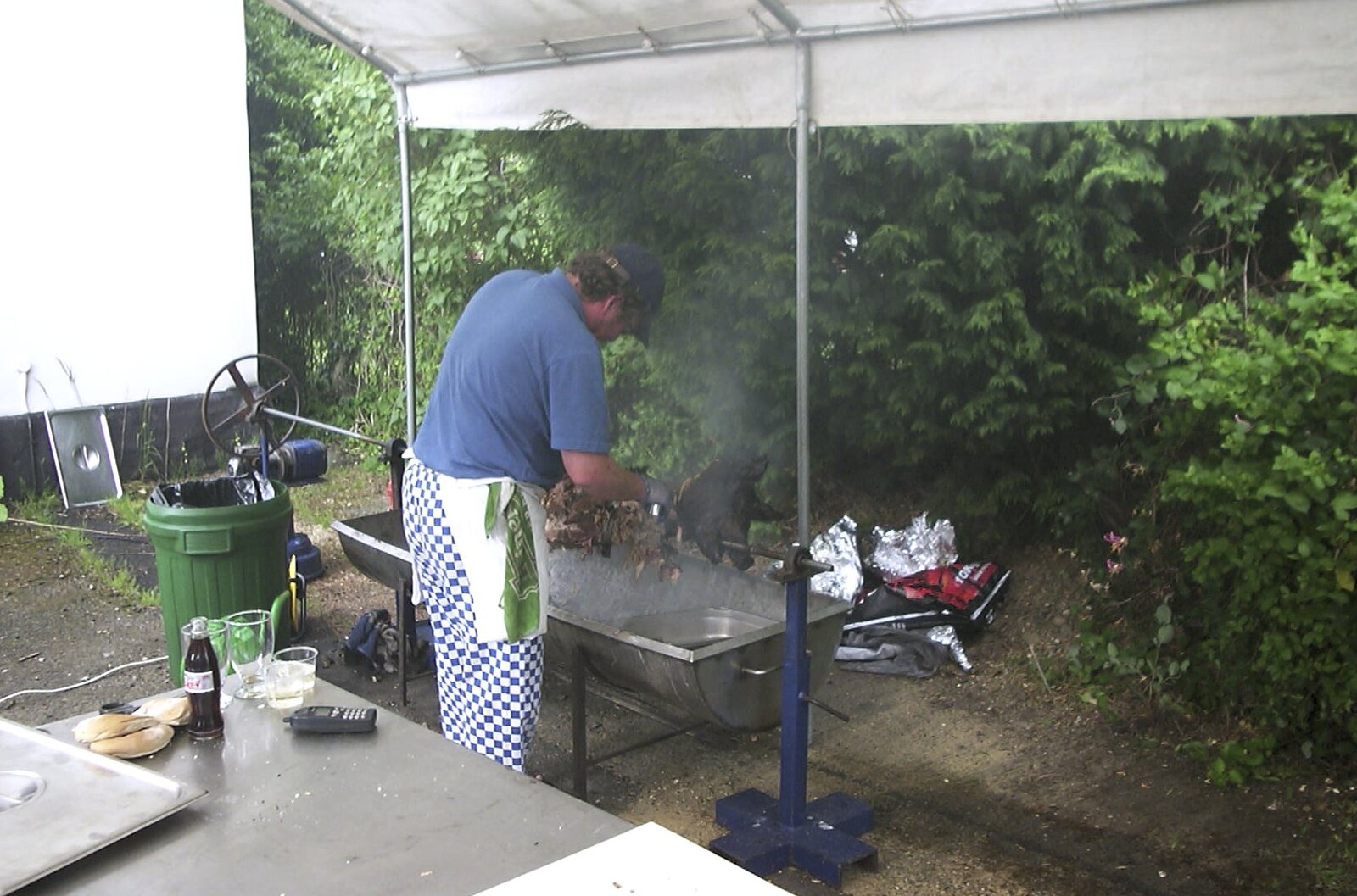 The hog roast smokes away from Golden Jubilee Celebrations, The Village Hall, Brome, Suffolk - 4th June 2002