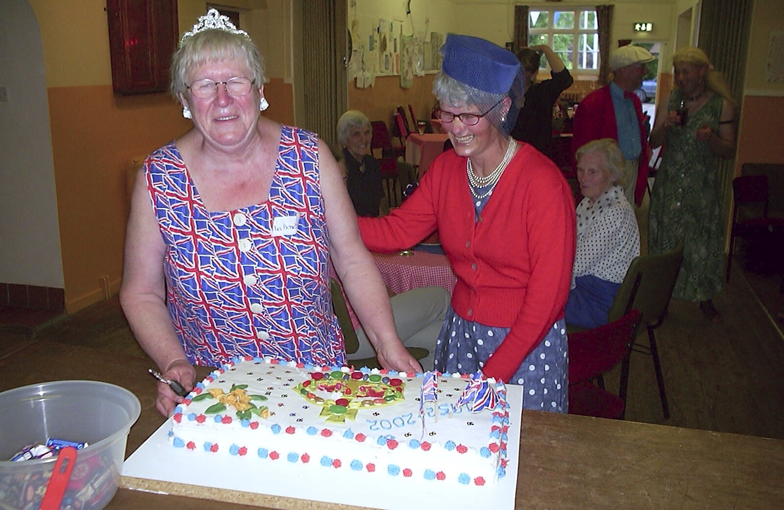 The cake is cut from Golden Jubilee Celebrations, The Village Hall, Brome, Suffolk - 4th June 2002