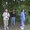 Colin, John, Pippa and Apple huddle under trees, A Rainy Barbeque at the Swan Inn, Brome, Suffolk - 15th June 2002